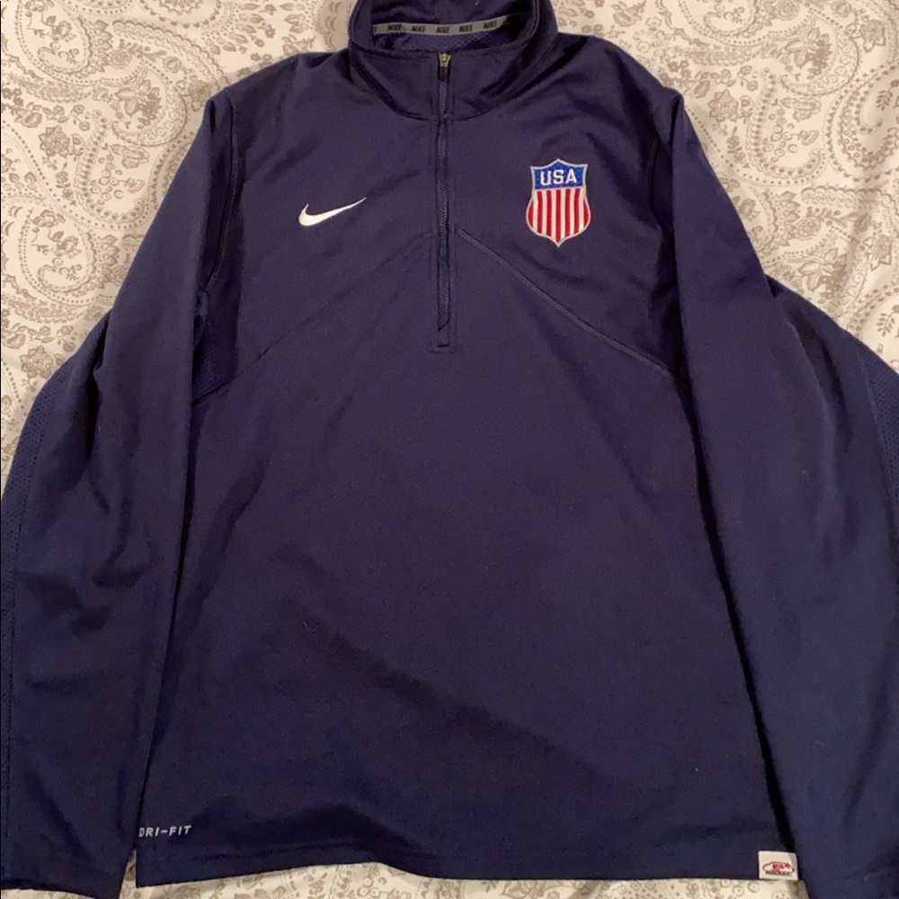 A navy blue USA Hockey quarter zip